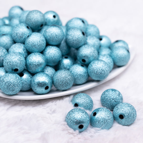 front view of a pile of 16mm Blue Stardust Acrylic Bubblegum Beads