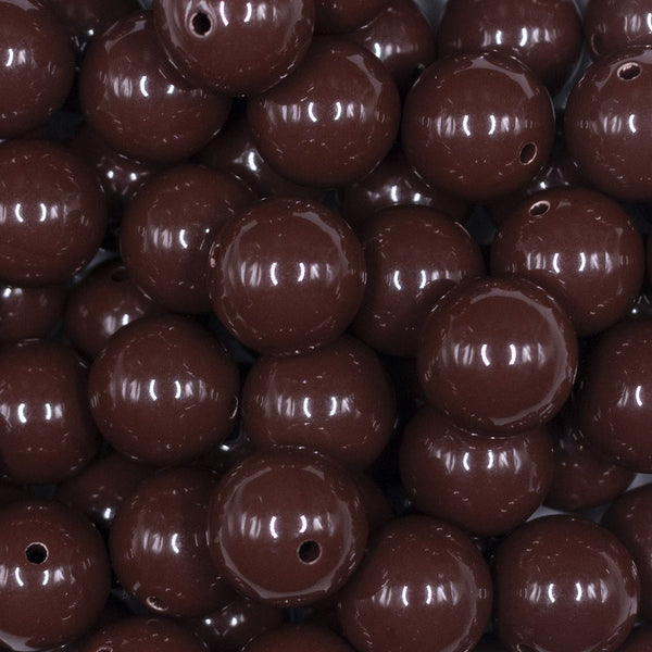 Close up view of a pile of 16mm Brown Solid Acrylic Bubblegum Jewelry Beads