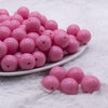 front view of a pile of 16mm Bubblegum Pink Solid Acrylic Bubblegum Jewelry Beads