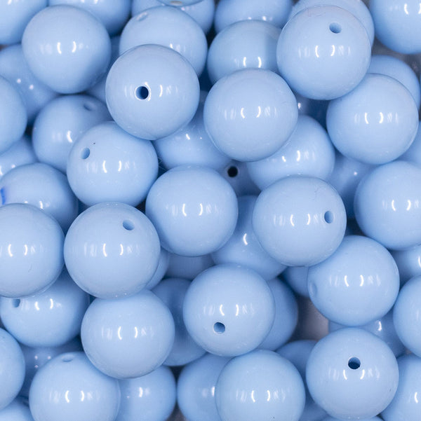 Close up view of a pile of 16mm Carolina Blue Solid Acrylic Bubblegum Jewelry Beads