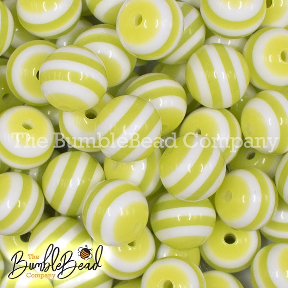 close up view of a pile of 16mm Chartreuse with White Stripe Bubblegum Beads