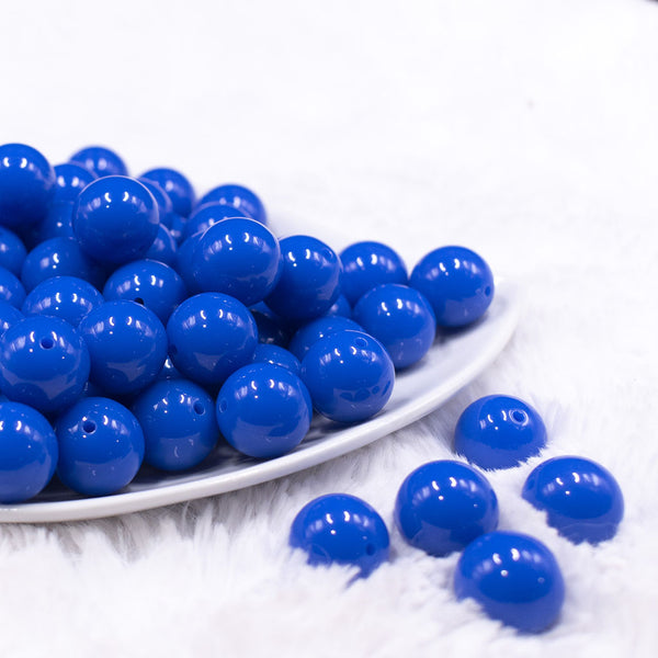 Front view of a pile of 16mm Cobalt Blue Solid Acrylic Bubblegum Jewelry Beads