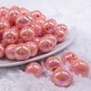 front view of a pile of 16mm Coral Orange Solid AB Bubblegum Beads