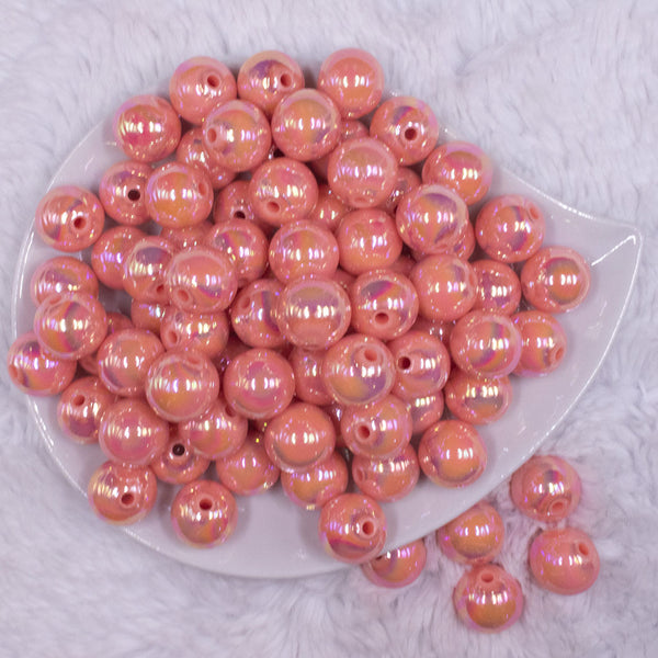 top view of a pile of 16mm Coral Orange Solid AB Bubblegum Beads