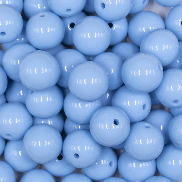 Close up view of a pile of 16mm Cornflower Blue Solid Acrylic Bubblegum Jewelry Beads