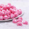 front view of a pile of 16mm Cotton Candy Pink with White Hearts Bubblegum Beads