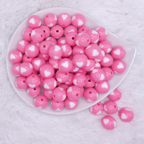 top view of a pile of 16mm Cotton Candy Pink with White Hearts Bubblegum Beads
