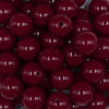 Close up view of a pile of 16mm Cranberry Red Solid Acrylic Bubblegum Jewelry Beads