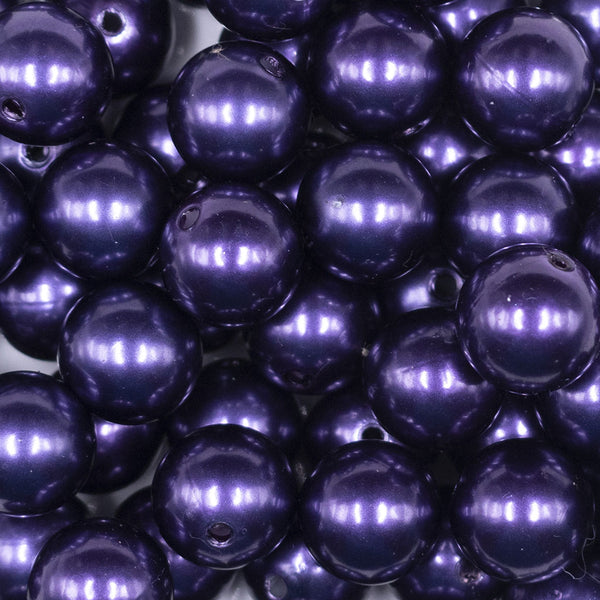 Close up view of a pile of 16mm Dark Purple Faux Pearl Acrylic Bubblegum Jewelry Beads