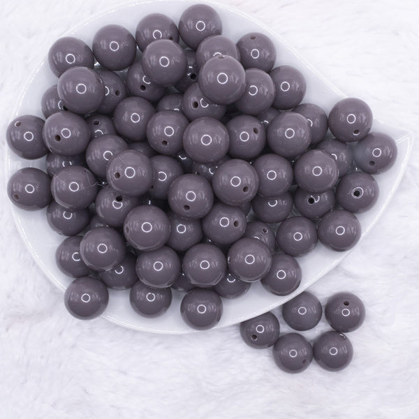 top view of a pile of 16mm Charcoal Gray Solid Acrylic Bubblegum Jewelry Beads