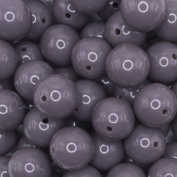 close up view of a pile of 16mm Charcoal Gray Solid Acrylic Bubblegum Jewelry Beads