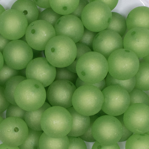 close up view of a pile of 16mm Green Frosted Bubblegum Beads