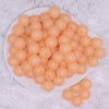 top view of a pile of 16mm Light Orange Frosted Bubblegum Beads