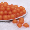 front view of a pile of 16mm Orange Frosted Bubblegum Beads