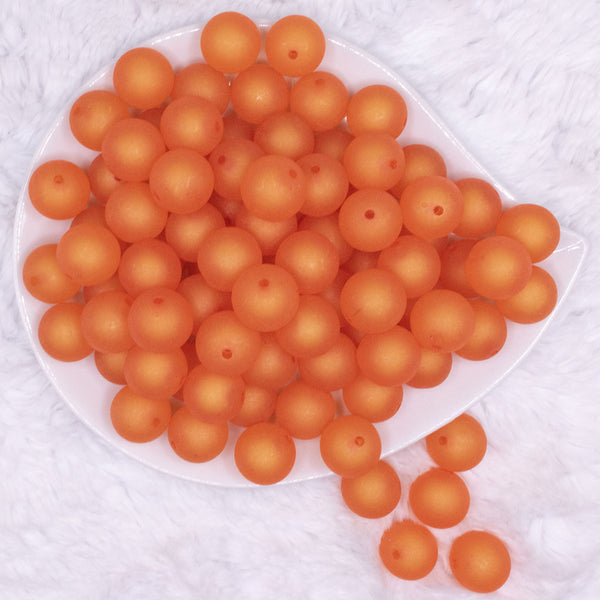 top view of a pile of 16mm Orange Frosted Bubblegum Beads