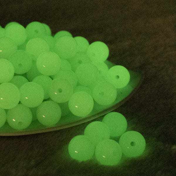 front view of a pile of 16mm glow in the dark bubblegum beads
