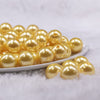 Front view of a pile of 16mm Golden Yellow Faux Pearl Acrylic Bubblegum Jewelry Beads