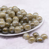front view of a pile of 16mm Green Galaxy Sparkle Resin Bubblegum Beads