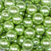 Close up view of a pile of 16mm Grass Green Faux Pearl Acrylic Bubblegum Jewelry Beads