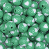 close up view of a pile of 16mm Green with White Hearts Bubblegum Beads