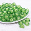 front view of a pile of 16mm Green Transparent Pumpkin Shaped Bubblegum Beads