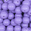 Close up view of a pile of 16mm Iris Purple Solid Acrylic Bubblegum Jewelry Beads