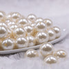 Front view of a pile of 16mm Ivory Pearl Acrylic Bubblegum Jewelry Beads