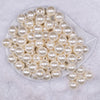 Top view of a pile of 16mm Ivory Pearl Acrylic Bubblegum Jewelry Beads