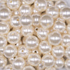 Close up view of a pile of 16mm Ivory Pearl Acrylic Bubblegum Jewelry Beads