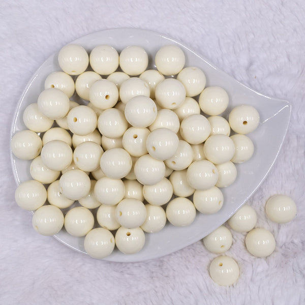 Top view of a pile of 16mm Off White Solid Acrylic Bubblegum Jewelry Beads