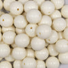 Close up view of a pile of 16mm Off White Solid Acrylic Bubblegum Jewelry Beads