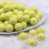 Front view of a pile of 16mm Key Lime Green Solid Acrylic Bubblegum Jewelry Beads