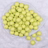 Top view of a pile of 16mm Key Lime Green Solid Acrylic Bubblegum Jewelry Beads