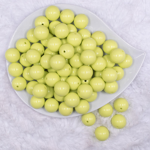 Top view of a pile of 16mm Key Lime Green Solid Acrylic Bubblegum Jewelry Beads