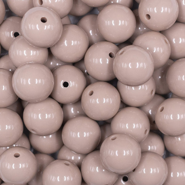 Close up view of a pile of 16mm Latte Brown Solid Acrylic Bubblegum Jewelry Beads