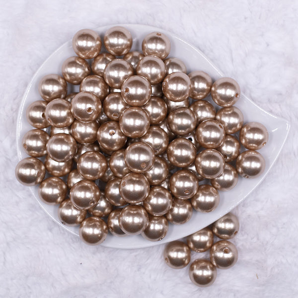 Top view of a pile of 16mm Light Champagne Gold Faux Pearl Acrylic Bubblegum Jewelry Beads