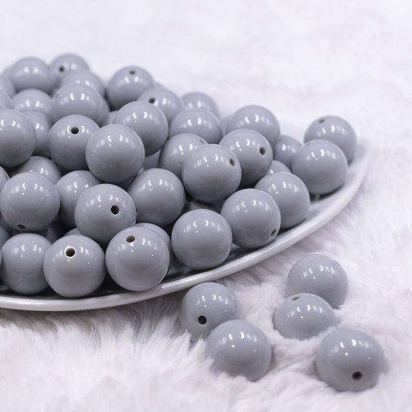 Front view of a pile of 16mm Light Gray Solid Acrylic Bubblegum Jewelry Beads