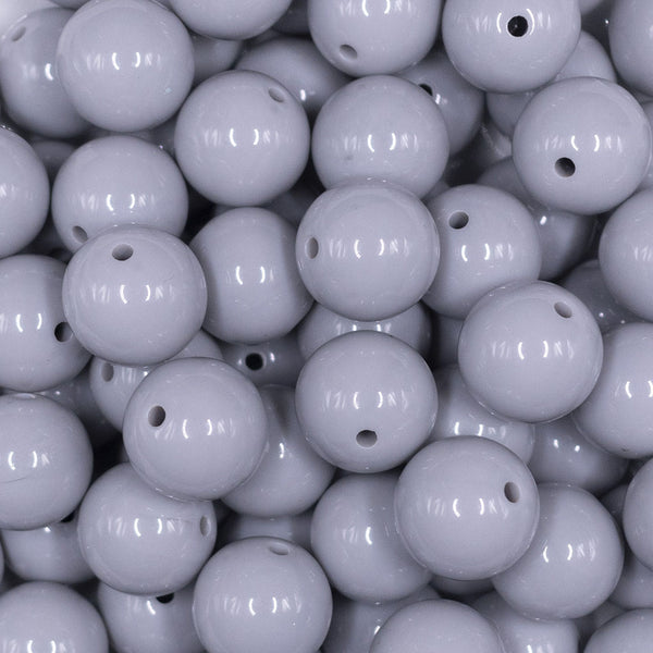 Close up view of a pile of 16mm Light Gray Solid Acrylic Bubblegum Jewelry Beads