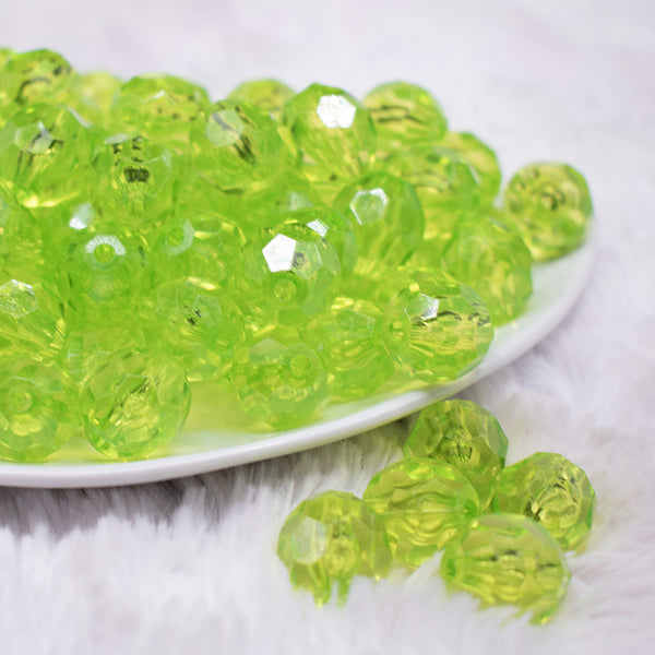 front view of a pile of 16mm Lime Green Transparent Faceted Bubblegum Beads