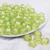 front view of a pile of 16mm Lime Green Transparent Pumpkin Shaped Bubblegum Beads