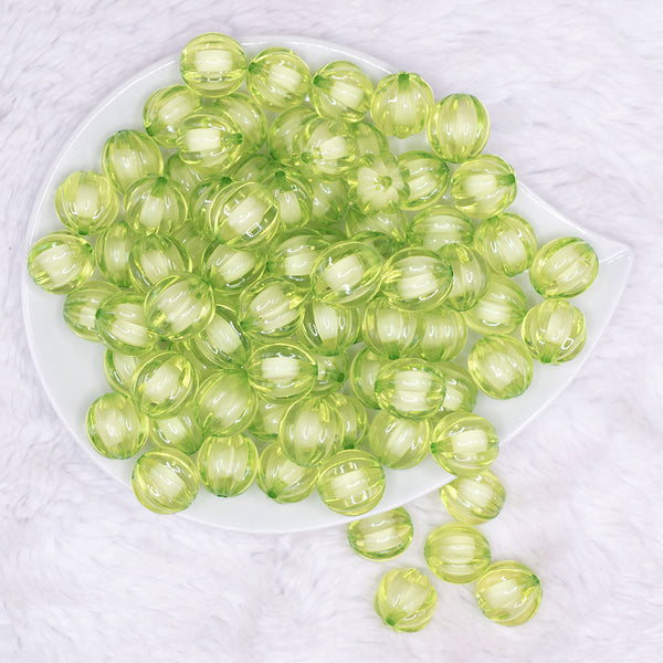 top view of a pile of 16mm Lime Green Transparent Pumpkin Shaped Bubblegum Beads