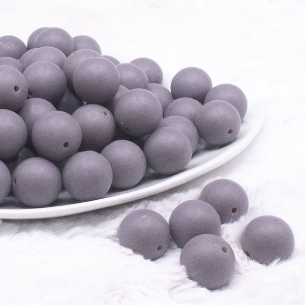 front view of a pile of 16mm Dark Gray Matte Solid Chunky Bubblegum Beads