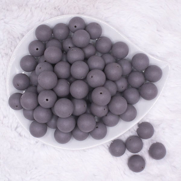 top view of a pile of 16mm Dark Gray Matte Solid Chunky Bubblegum Beads