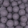 close up view of a pile of 16mm Dark Gray Matte Solid Chunky Bubblegum Beads