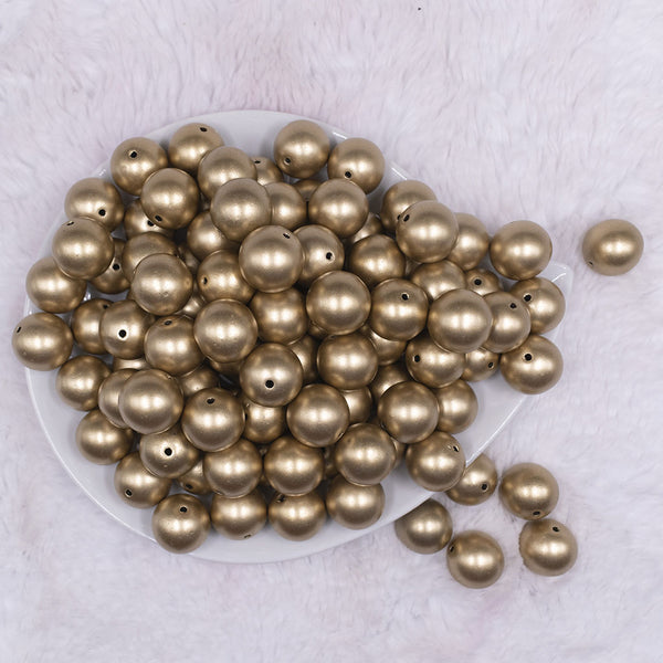 Top view of a pile of 16mm Gold Matte Pearl Acrylic Bubblegum Jewelry Beads