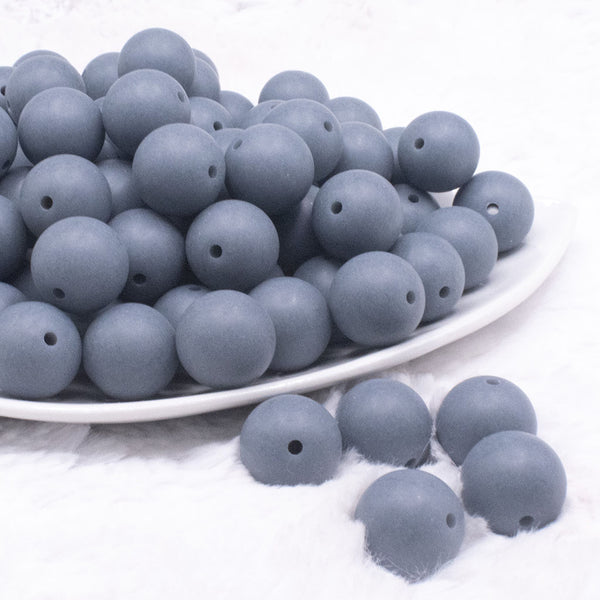 front view of a pile of 16mm Seel Blue Matte Solid Chunky Bubblegum Beads