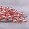 Front view of a pile of 16mm Melon Orange Faux Pearl Acrylic Bubblegum Jewelry Beads
