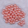 Top view of a pile of 16mm Melon Orange Faux Pearl Acrylic Bubblegum Jewelry Beads