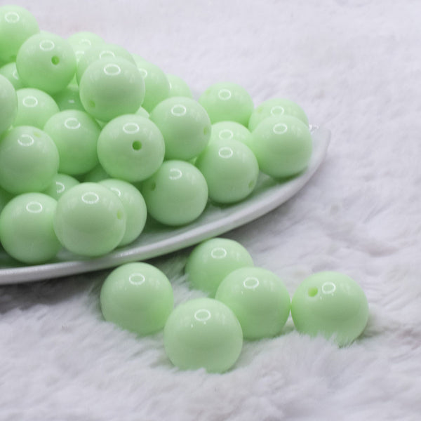 front view of a pile of 16mm Mint Green Solid Acrylic Bubblegum Jewelry Beads