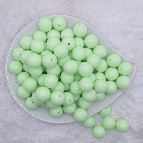 top view of a pile of 16mm Mint Green Solid Acrylic Bubblegum Jewelry Beads